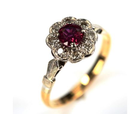 An 18ct gold ruby and diamond cluster ring, set with round-cut ruby and single-cut diamonds, setting height 9.8mm, size M, 2.