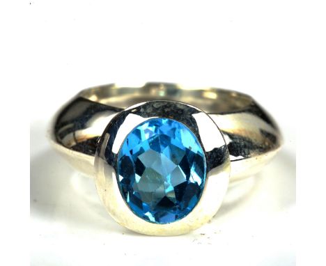 A large modern sterling silver blue topaz dress ring, setting height 14.4mm, size O/P, 11.3gNo damage or repairs 