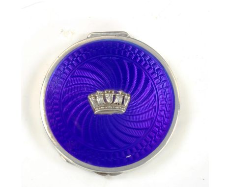 A George V Art Deco silver and blue enamel Cinque Ports compact, circular form with engine turned guilloche decoration, with 