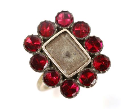 A Georgian flat-top garnet memorial ring, unmarked gold settings with vacant central panel, setting height 20.6mm, size L/M, 