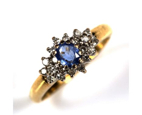 A late 20th century 18ct gold sapphire and diamond cluster ring set with oval mixed-cut sapphire and eight-cut diamonds, tota