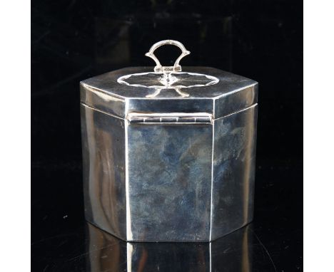 An Edwardian hexagonal silver tea caddy, with swing handle, by Thomas Bradbury & Sons, hallmarks Sheffield 1902, height 8.5cm