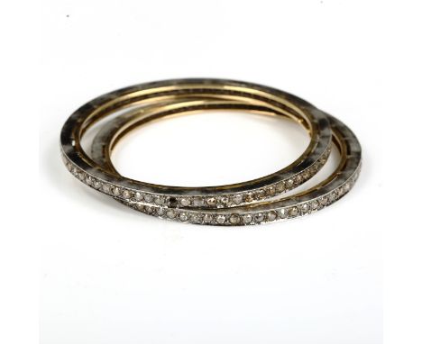 A pair of Indian silver on gold diamond slave bangles, set with rose-cut diamonds, band width 3.6mm, internal diameter 5.5cm,