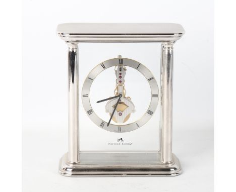 MATTHEW NORMAN - a rhodium plated Helios Skeleton 8-day mantel clock, silvered chapter ring with Roman numerals and pillar su