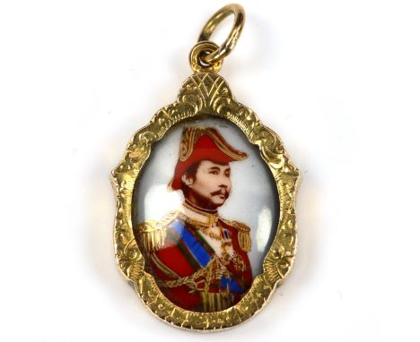 An Eastern unmarked high carat gold porcelain portrait pendant, with printed central portrait, pendant height excluding bale 