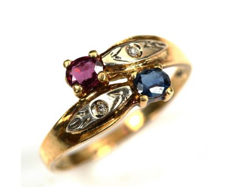 An 18ct gold ruby sapphire and diamond crossover ring, setting height 9.2mm, size M, 2.5gNo damage or repairs, all stones pre