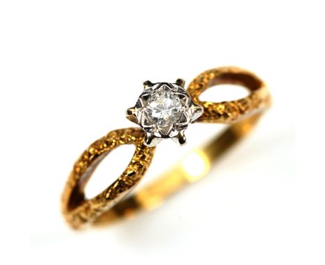 An 18ct gold 0.1ct solitaire diamond ring, illusion set with openwork textured shoulders, size M, 3.3gNo damage or repairs, d