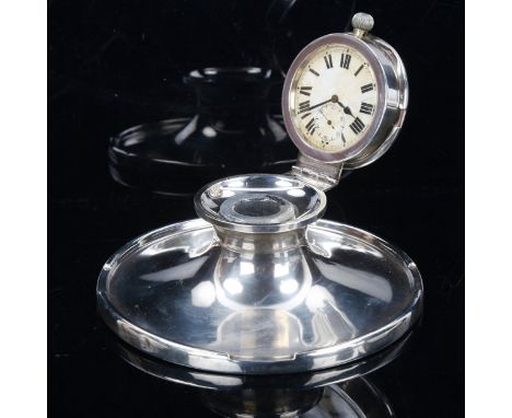 A George V silver-mounted pocket watch Capstan inkwell, with lid containing pocket watch movement and ceramic liner, by A & J