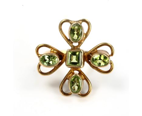 A large silver-gilt peridot clover ring, set with square and oval mixed-cut peridot, setting height 26.5mm, size M, 6.6gRing 