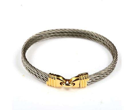 FRED of PARIS - a French steel and 18ct gold Force 10 bracelet, band width 7.1mm, internal measurements 5.5cm x 4.5cm, 16.5gN