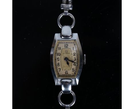 OMEGA - a lady's Vintage stainless steel mechanical bracelet watch, tonneau champagne dial with Arabic numerals and blued ste