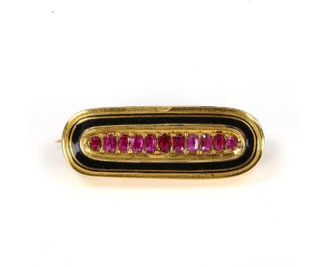 A Victorian ruby and black enamel mourning brooch, unmarked gold settings with oval mixed-cut ruby, brooch length 32.3mm, 4.6