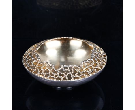 STUART DEVLIN - an Elizabeth II silver and silver-gilt dish/bowl, circular form, with pierced textured organic rim and parcel