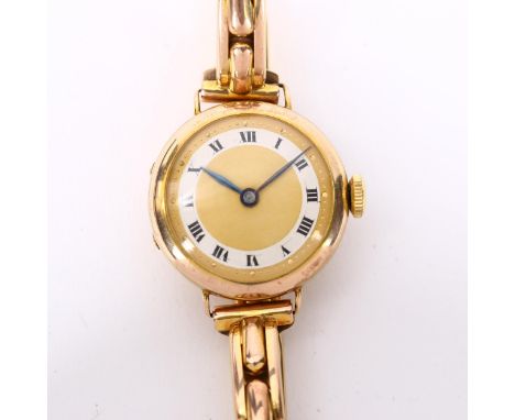 A lady's early 20th century 9ct gold mechanical bracelet watch, champagne dial with silvered chapter ring, Roman numerals, bl