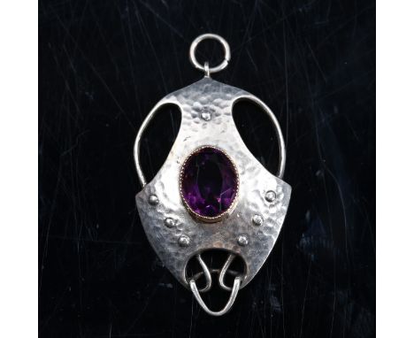 MURRLE BENNETT - an Arts and Crafts silver and amethyst openwork pendant, hand planished decoration set with oval mixed-cut a