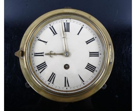 A 19th century brass-fronted circular dial bulkhead 30-hour wall clock, cream enamel dial with Roman numeral hour markers, di