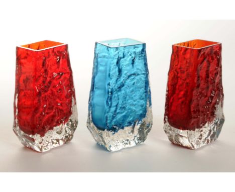 A group of three mid 20th Century Whitefriars Coffin shaped textured vases, pat number 9686, two in ruby red colour and anoth