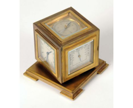 A mid 20th century brass bodied weather station by Kirby Beard & Co, Paris, the cube shaped body having clock, barometer, the
