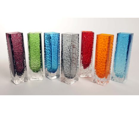 A group of Whitefriars glass Nailhead design vases pat number 9683 designed by Geoffrey Baxter in pewter, ruby red, tangerine