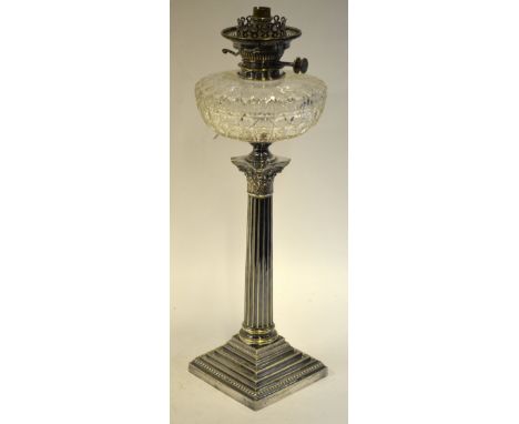 A table lamp with cut glass front (converted to electric), on neo-classical electroplated fluted column and stepped square ba