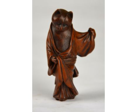 A Japanese wood netsuke carved in the form of a robed cat, 20th century, 5.5 cm high Condition Report Chip to base of the rob