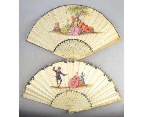 A 19th century Continental fan, the paper leaf painted with Watteauesque scenes of elegant 18th century figures gossiping on 