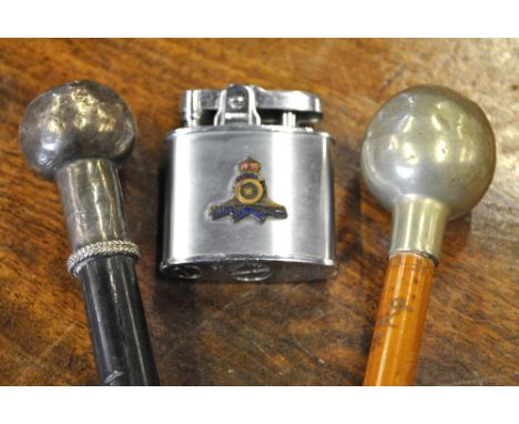An ebony military swagger stick, the white metal pommel embossed with the badge of the 6th Gurkha Rifles, another swagger sti
