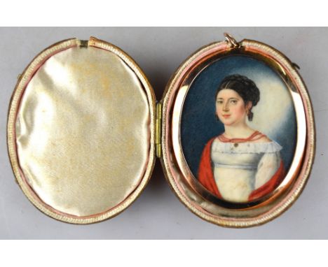 A Regency period oval portrait miniature of an elegant young lady with fashionably dressed hair, coral necklace, white dress 