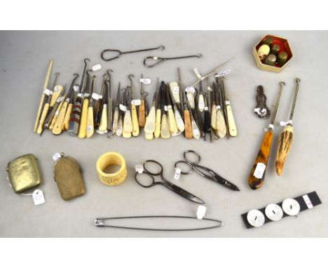 A collection of button-hooks, spikes, scissors etc