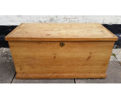 A rectangular pine flat top trunk