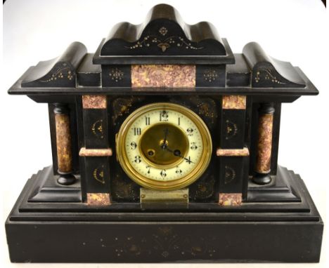 A late 19th century slate and marble architectural form eight-day mantel clock having an interesting presentation plate engra