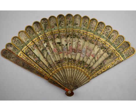 A Chinese 19th century lacquered fan, finely painted with polychrome and gilt enamels of figures on a terrace within a floral