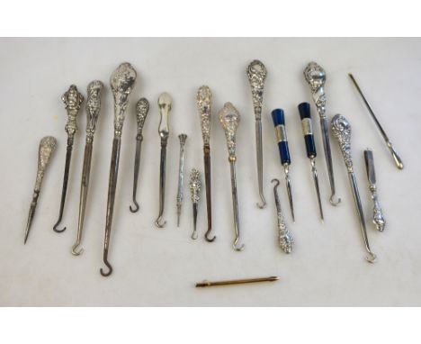 Nineteen various silver and other button-hooks, tweezers, spikes, propelling pencils, etc.