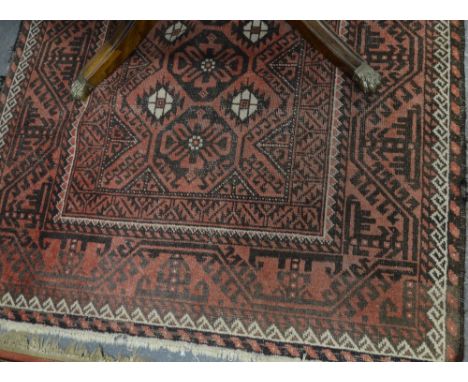An old Turkish rug, geometric design on pale red ground, 1.93 x 1.20 m Condition Report Even overall wear, ends and sides req