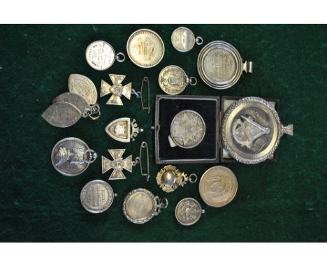 A small collection of 19th century and later assorted silver school medallions comprising a large Victorian Huddersfield Coll