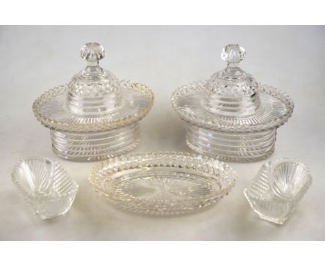 A pair of 19th century Irish oval bonbonieres having step cut straight sides and hobnail cut outsweeping rims, 19 cm high, 19