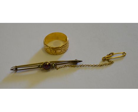 An 18ct yellow gold engraved ring with hearts and flowers, approx. 4.5g to/w a bar brooch set with garnet and seed pearls hav