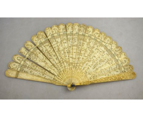 A 19th century Chinese Canton ivory brise fan with twenty-one finely pierced and carved inner sticks, the two guard sticks ca