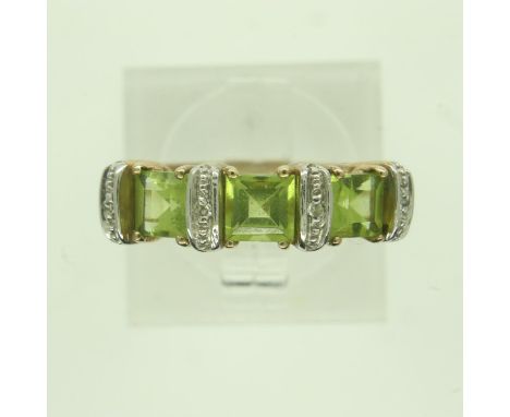 Contemporary 9ct gold ring set with peridot and diamonds, size P, 3.0g. P&amp;P Group 0 (£6+VAT for the first lot and £1+VAT 