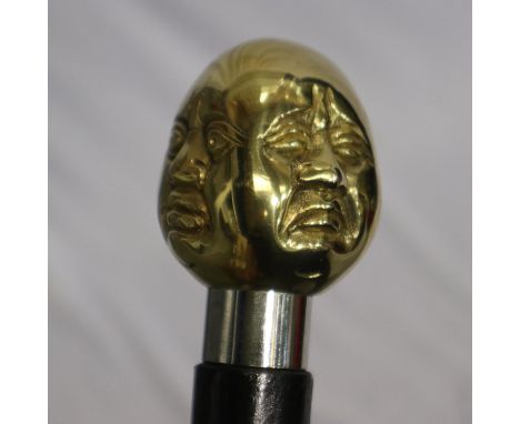 Brass four faced Buddha handled walking stick, L: 96 cm. UK P&amp;P Group 2 (£20+VAT for the first lot and £4+VAT for subsequ