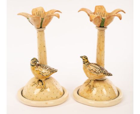 Anna Lambert, a pair of studio pottery candlesticks, modelled as quail and applied leaves,  (damaged), 22cm high CONDITION RE