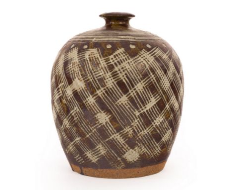 A Studio Pottery stoneware table lamp base, with combed wax resist decoration, incised mark to base MH, 22cm high CONDITION R