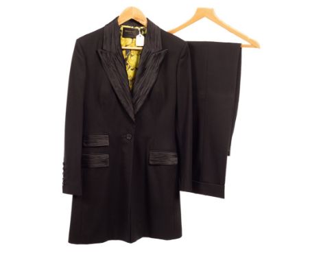 A Bruce Oldfield Couture black wool crepe trouser suit with pleated taffeta collar and cuffs and bright floral silk lining, s