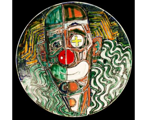 Tony Morris for Poole Pottery, a studio wall charger decorated a clown, 42cm diameter/Note: Tony Morris designed artwork and 