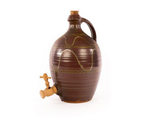Ray Finch (1914-2012) for Winchcombe Pottery, a large stoneware cider jug, painted wavy design on iron glaze, handle to side,