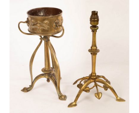 Attributed to WAS Benson, a brass table lamp, with leaf cast tripod base, 38cm high and an Art Nouveau brass jardiniere on tr