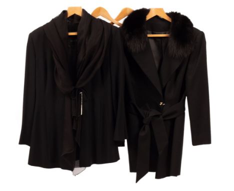 A black wool crepe trouser suit with chiffon tie collar and rouleau tie front and another black wool crepe trouser suit with 