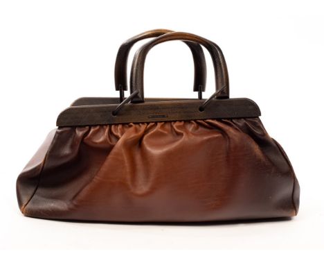 A Gucci brown leather doctor's bag with wooded handles and trim CONDITION REPORT: The bag is scratched in some areas and has 