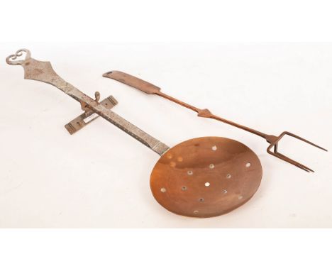 An Arts & Crafts style copper chestnut roaster with steel handle, marked WP03, 70.5cm long, with wall mount and a copper toas