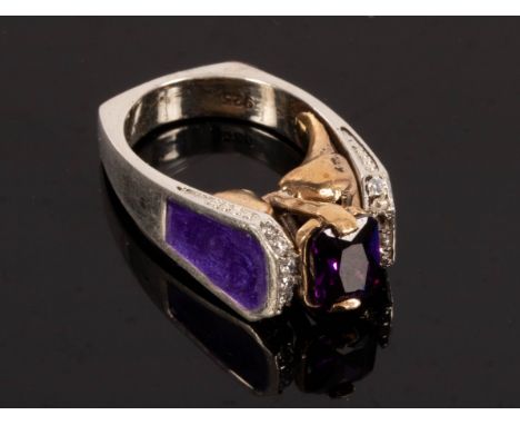 A modernist amethyst ring, the silver shank with purple enamel shoulders, stamped 925, size J and a silver and enamel ring mo